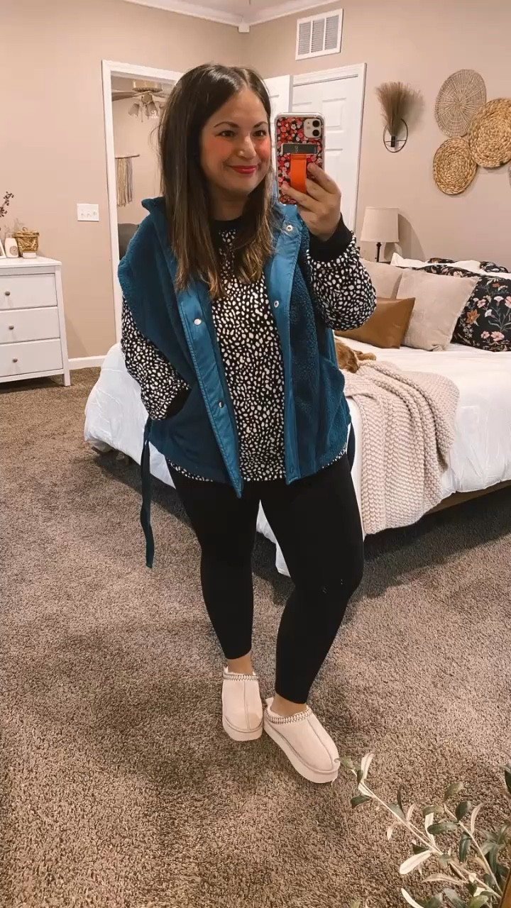 Layering is key for staying warm and stylish during those chilly days! This cozy fleece vest from Amazon is the perfect addition to your outfit. Pair it with a lightweight long-sleeve tee and some leggings for a comfy look or with a pair of black jeans to dress it up a little.

slippers: fit true to size // wearing a 5
leggings: fit true to size // wearing a short large
long sleeve: fits true to size // wearing a large
vest: fits true to size, maybe a tad small // wearing a large 

 #LTKMidsize #LTKFindsUnder50 #LTKStyleTip