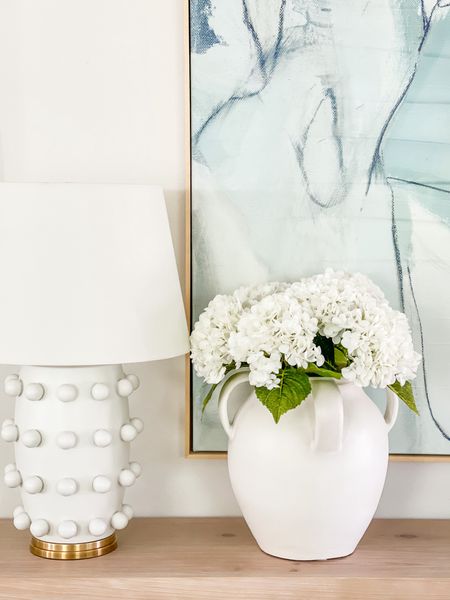 Seriously in love with these real-touch faux hydrangeas! This is after  I ordered another set for this large white ceramic vase (two sets total). They’re perfect for spring and summer decor (and come in several colors)! Also linking our long light wood console table, blue abstract art and circle dot lamp! 

. #ltkfindsunder50 #ltkfindsunder100 Amazon decor, favorite vase, designer lamp

#ltkhome #ltkseasonal #ltksalealert #ltkstyletip #ltkover40

#LTKfindsunder50 #LTKSeasonal #LTKhome