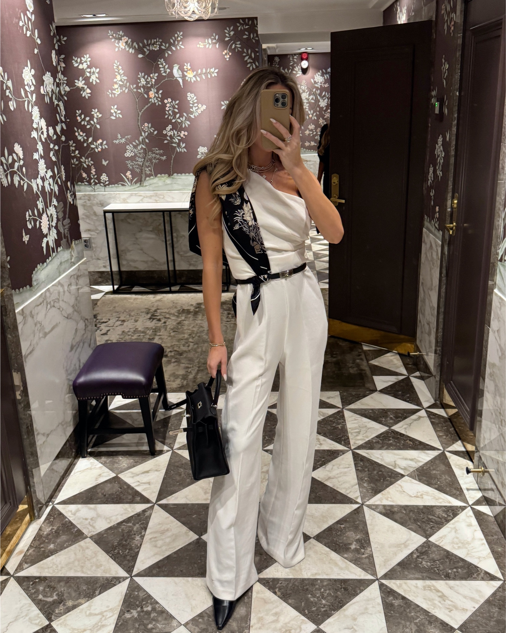 Chic evening wear look with an elegant white one shoulder jumpsuit. Great fit and flattering material that’s easy to maintain. Styled it with black accessories- a black Kelly belt with palladium hdw and a black Kelly bag. How do you like the scarf detail on my shoulder? I thought it was a creative and chic way to style it🤍

#LTKItBag #LTKStyleTip #LTKParties