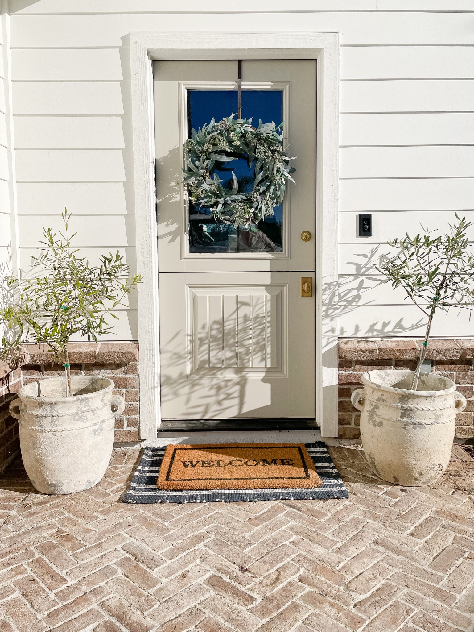 Front porch decor

#dutchdoor #porchplanters #brickpatio #outdoorrugs

#LTKhome