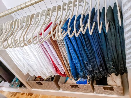 One of the easiest ways to transform a closet is to invest in matching hangers. These velvet versions give consistency in size and color which is key to a harmonious space!


