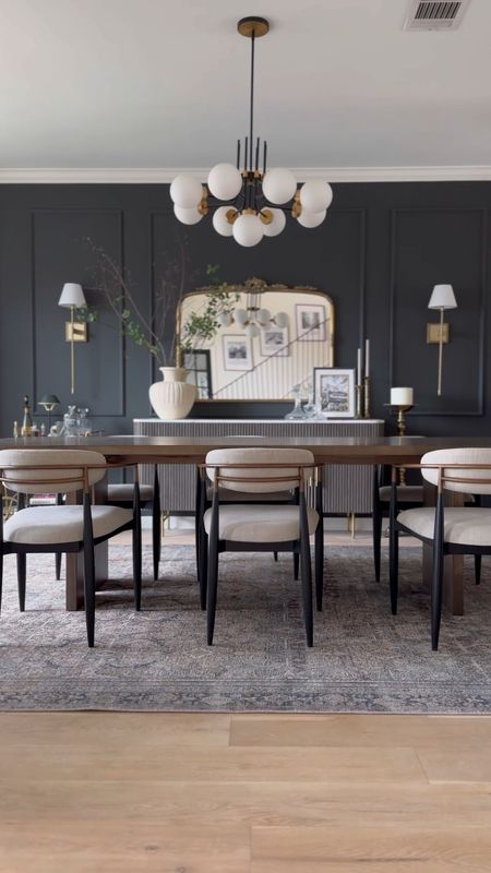 Moody dining room decor! 🖤

Dining chairs: Cary Linen
Dining table: 108” long
Rug: Olive/Charcoal ‘9x12’
Sideboard: Liath Smoke
Bar cart & floor candelabra are vintage! Paint color is Iron Ore by SW.

#LTKstyletip #LTKhome #LTKsalealert
