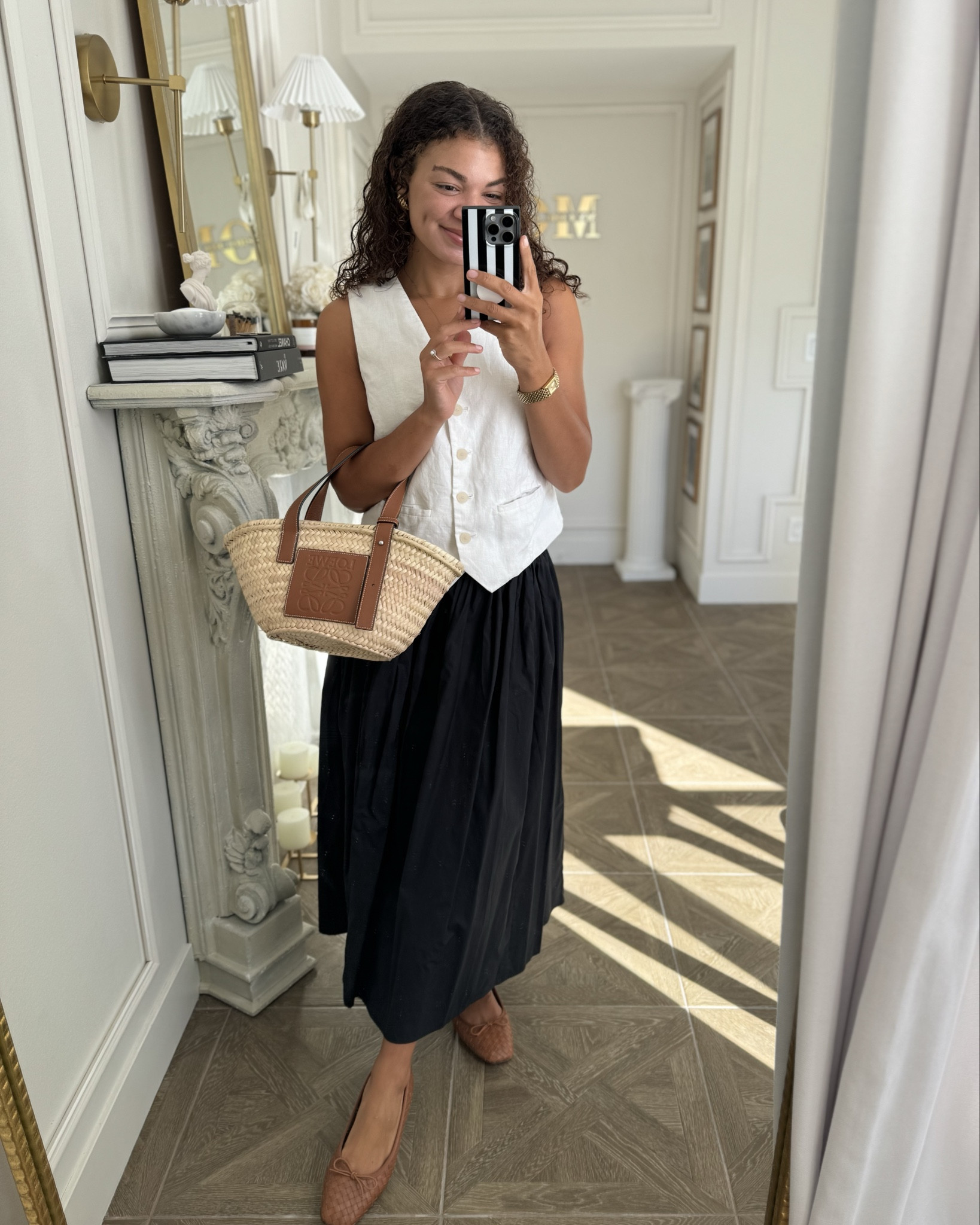Classy chic summer outfit idea: white linen vest, black midi skirt, ballet flats, straw bag, and accessories. My linen vest is old from Mango, so linking similar. The skirt I’m wearing is from Banana Republic Factory, but sizes are limited so also linking another one I love. The shoes are tts (they do rub a bit FYI, but I also have big bunions) 

#LTKFindsUnder100 #LTKSummerSales #LTKSeasonal