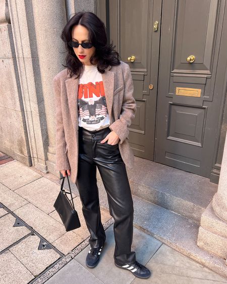 graphic tee by anine bing 
wool blazer by arket 
samba trainers by adidas 
black sunglasses by arket 
bag by manu atelier 
leather trousers by Sundarbay 
alternative vegan leather trousers by nanushka 

#LTKeurope #LTKSeasonal #LTKstyletip