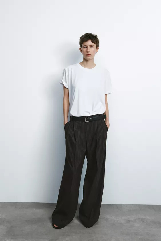 Mid-rise pants with belt loops. Double pleat detail. Side pockets and faux back welt pockets. Con... | Zara US