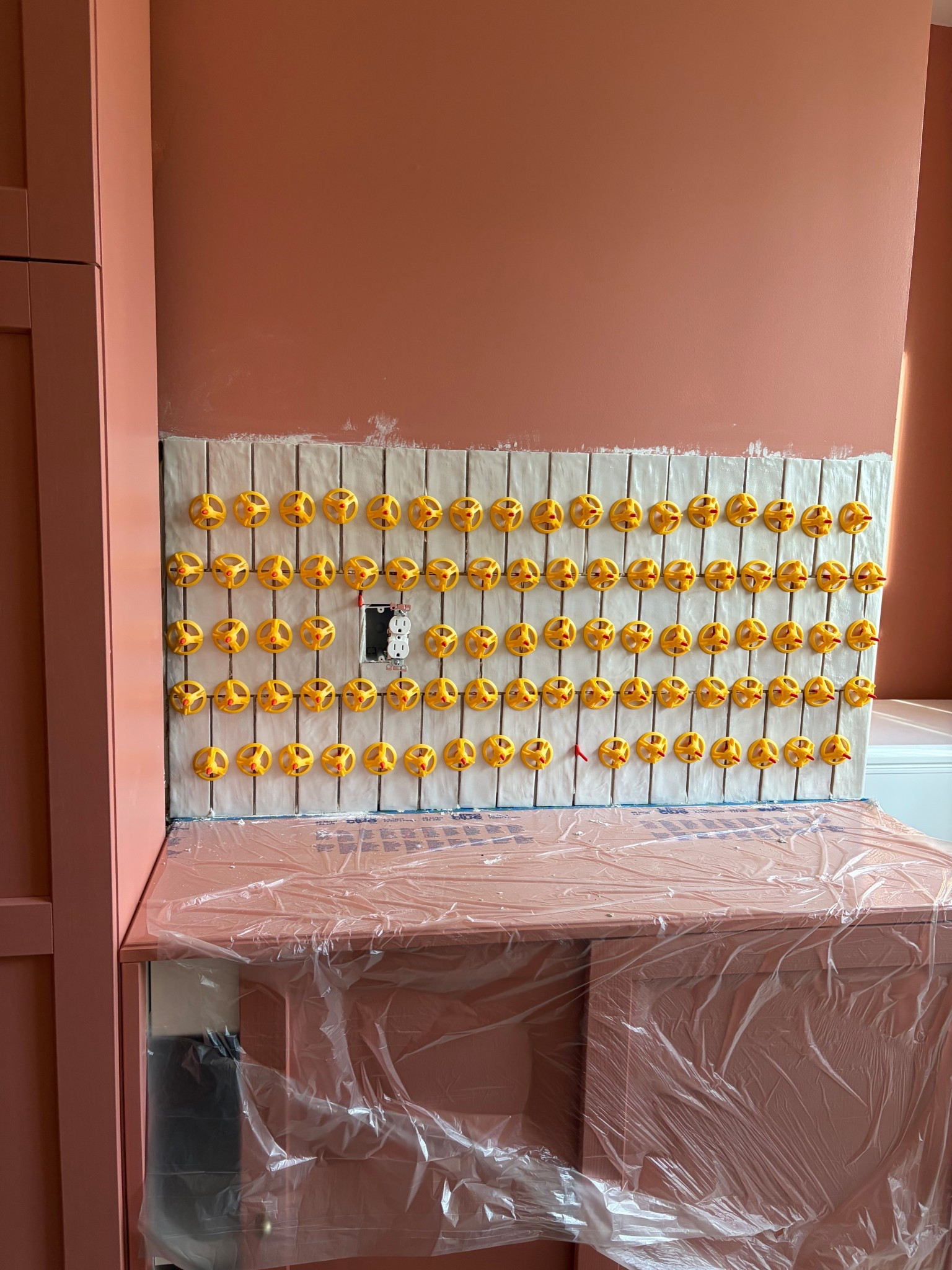 Tile going in… grout next and then a shelf on top! 