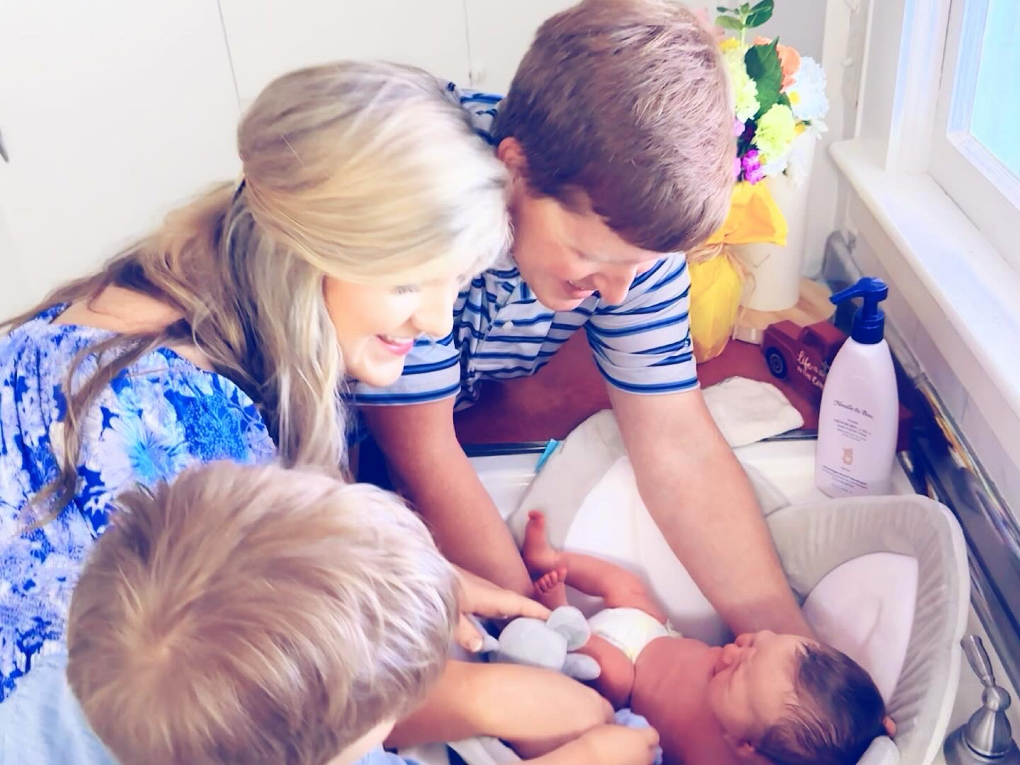 Scrub a dub dub 🧼, we’ve got a new lil’ baby 👶🏼 brother in the tub!!! 🛁🫧🤱🧽 #babysfirstbath #kitchensinkbathsarethebest 

There’s just simply nothing sweeter than giving a baby his first sponge bath in the kitchen sink 🥰, and especially this time around getting to see our firstborn Judson be so involved and the BEST little helper!! 🫶🏽 He wanted to find Sweet Baby Levi Rhett a towel (and toys hehe 🤭) and is so gentle and protective of his baby brother!! 😭 Be still heart!! 🥹🤱🩵 #bigbrotherjudson #sweetbabylevirhett #brotherlove 

PS. Linked all of our newborn bath 🧼 essentials over on my LTKit shop 🛍️ (link in my bio 🔗!!) - including this adorable new @bloomingbath 🌸 that we are now obsessed with!! 🙌🏽 Perfect for a small kitchen sink and for these precious newborn days!! 👶🏼 #newbornbath

#LTKHome #LTKFamily #LTKBaby