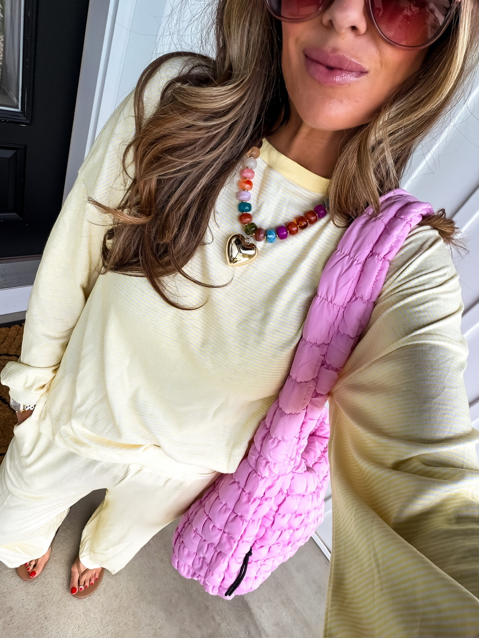 This soft yellow lounge set is the definition of comfy but still cute 💛 The relaxed fit, lightweight fabric, and fun accessories make this such an easy everyday outfit for travel days, coffee runs, lounging at home, or busy mom life. Also obsessed with the pop of pink from this quilted tote.

yellow lounge set, comfy everyday outfit, casual mom style, matching lounge set, travel day outfit, cozy chic outfit, relaxed fit set, colorful accessories outfit, casual summer outfit, airport style outfit, everyday comfy fashion, themominstyle

#LTKmomlife #LTKSeasonal #LTKootd