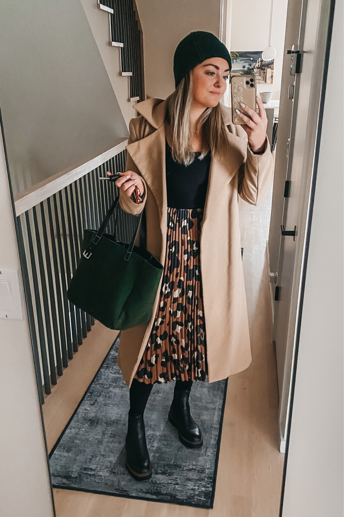 Long Camel Coat and Pleated Leopard Skirt are old - linked current similar items at multiple price points.

Ribbed Squareneck top is so flattering, true to size. (m)

Also linking my black tights, beanie, waterproof lugsole booties (size up a half size if you have a wider foot), and green/black recycled felt tote. It’s on MAJOR sale!

#LTKstyletip #LTKshoecrush #LTKSeasonal