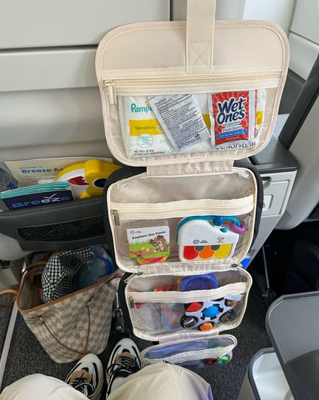 Soooo glad I got this for Scotty’s first flight. Got one for Ellie too!! Just hung it from the seat in front of us. So much better than digging through my bag! 

Baby travel essentials. Baby must haves. Travel organizer. Flight essentials. Baby toys. Toddler toys. Toddler hacks.  

#LTKkids #LTKtravel