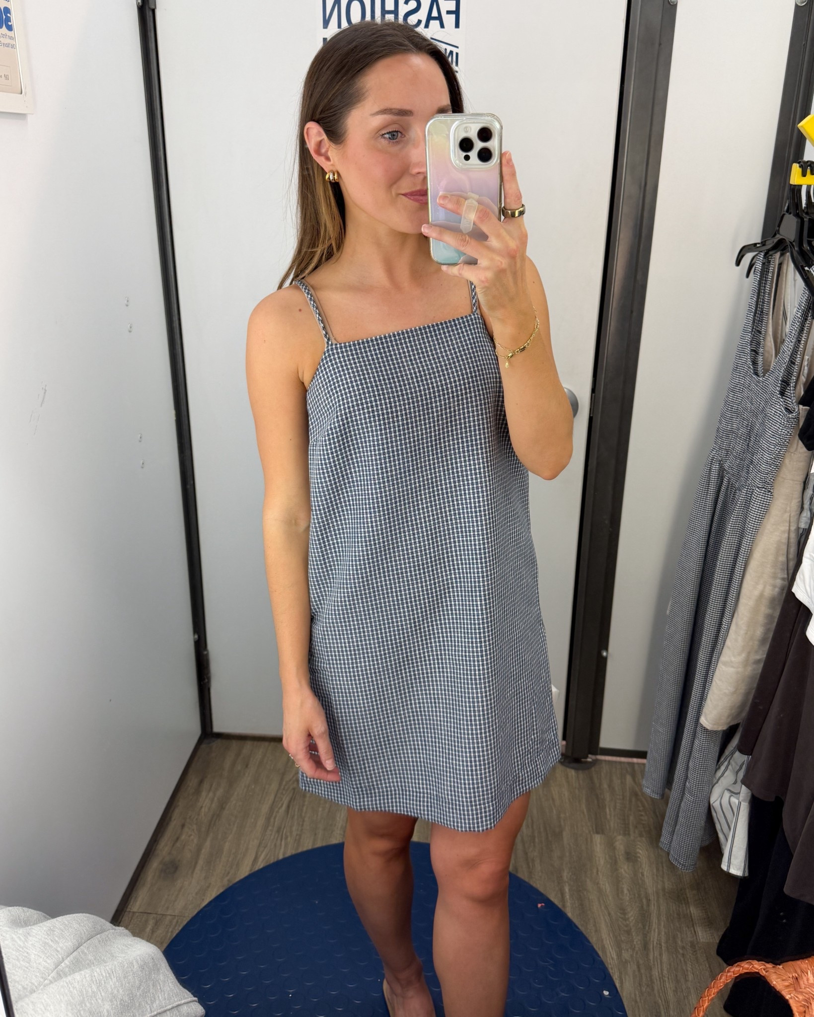 This shift dress is super cute and has bows in the back where the straps meet the dress. Grab it now for 50% off at Old Navy. I would say this runs short and is the perfect length on me at 5 foot three. If you are a little taller, I would order the tall. ￼