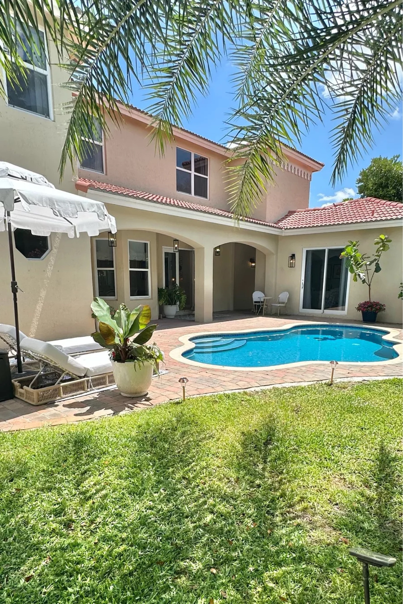 Poolside loungers chaise lounge, patio umbrella, scalloped umbrella, outdoor lights, solar lights, pendants

#LTKHome