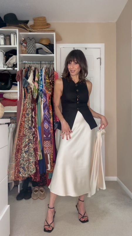 This silk skirt can be worn in so many ways! I shared a couple of them in this video. It comes in many colors and prints. It fits true to size, but if you size up, it just creates a different look as I explained in the video

Vest fits true to size. The Tee shirt is old from Banana republic .

#LTKFindsUnder50 #LTKOver40 #LTKStyleTip