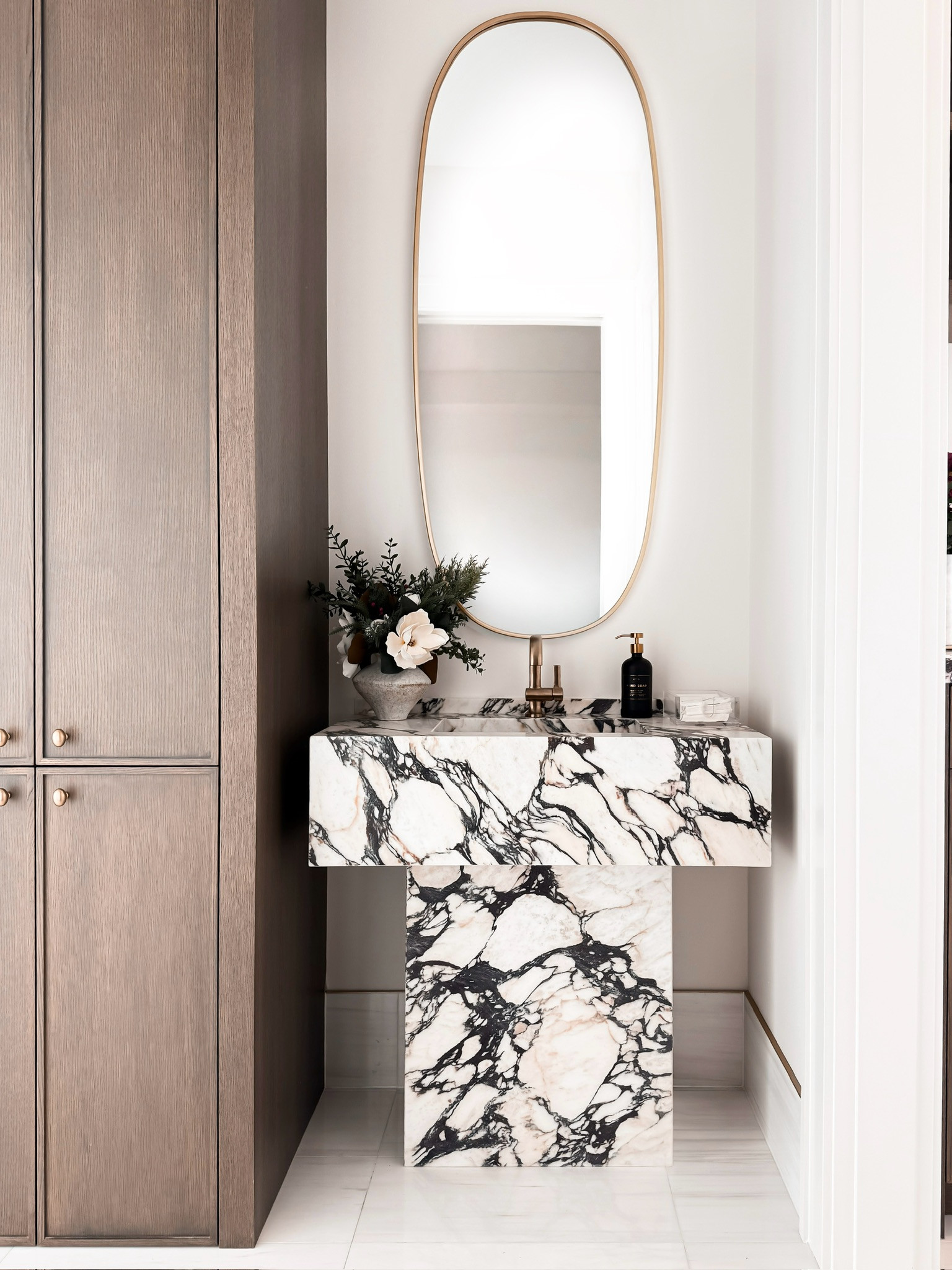 ELEVATED MODERN VANITY WITH MARBLE DETAIL! This sculptural marble vanity instantly elevates an entryway or bathroom with its modern, high-end feel. The bold stone veining paired with warm wood tones and an oversized mirror creates a look that feels architectural, refined, and timeless. A statement piece that brings designer impact without overwhelming the space.

#Amazon #TheHillaryStyle #AmazonHome #ModernOrganicDecor #NeutralHomeDecor #LuxuryHomeStyle #EntrywayInspo #BathroomDesign #MarbleDecor #ElevatedInteriors 

 #LTKmomlife #LTKOver40 #LTKHome