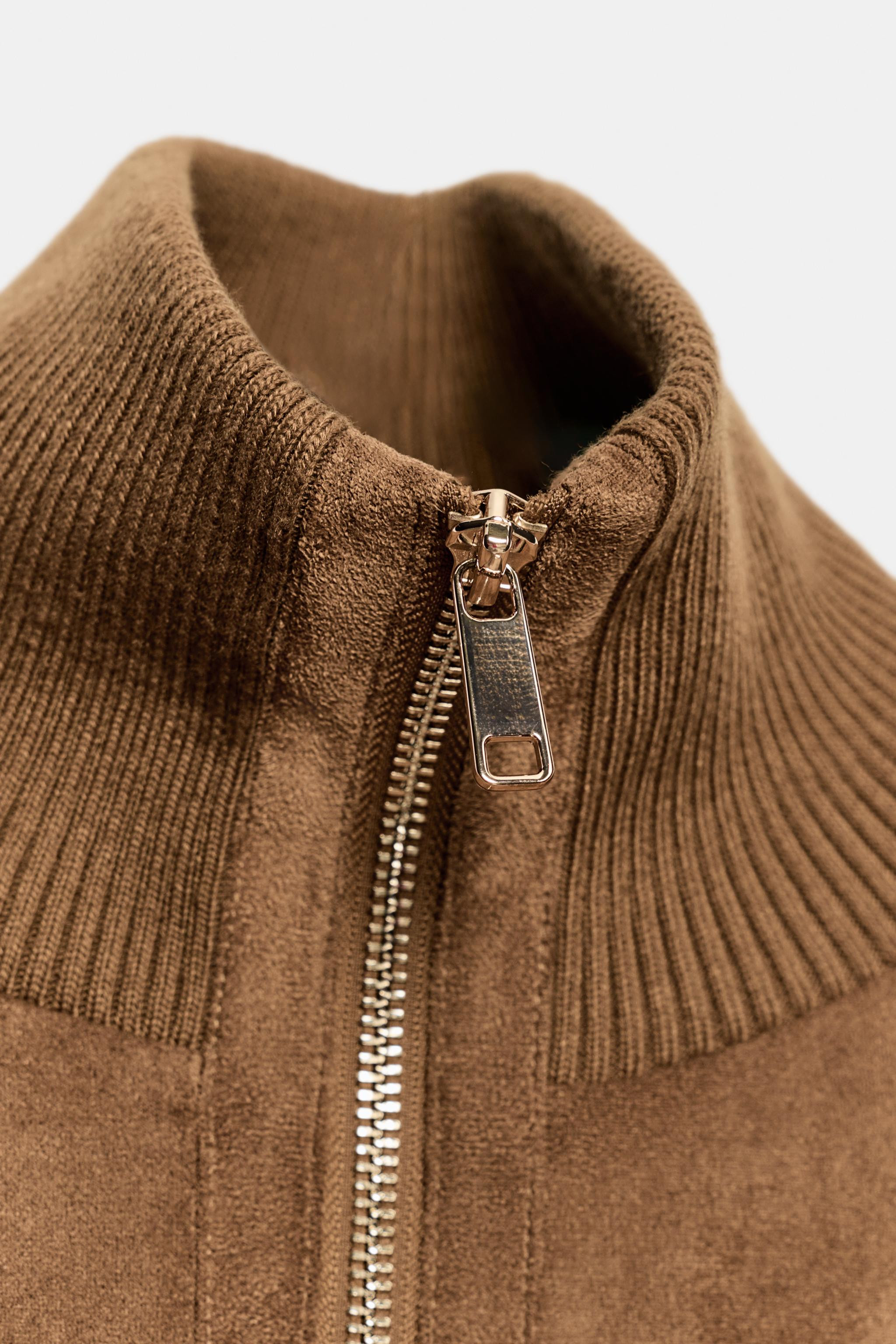 Bomber jacket with a stand-up collar and long sleeves. Front patch pockets with flaps. Ribbed tri... | Zara US