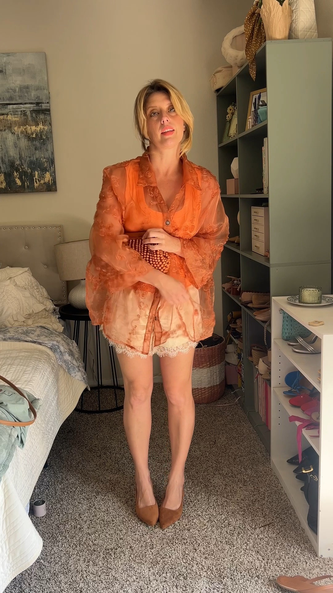 How to style a vintage organza oversized top for Fall in Texas (or the South).
Base: Silk shorts and a peach tank. Hair is in a French hair pin.

Look 1 - Chloe bag in rust orange, a chunky amber necklace and leather Jcrew flip flops

Look 2 - Wear a fringe bag and no jewelry / boots would be fun! 

Look 3 - Suede slingbacks and a bold textured beaded clutch

Linked accessories below!