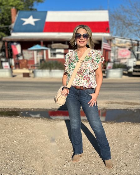 Big smiles because I’m standing in front of one of my favorite spots! This historic building is home to lots of family memories. It used to be a post office/general store but for us it’s been a family restaurant and live music destination where our boys grew up playing in the field out back with cattle looking on! Went to hear some amazing live music this weekend and they’re still rocking! 

Outfit details:
Top-size small
Jeans-size 6
Belt-OLD (like over a decade)

I’m still rocking too-today is my 50th birthday! 

#rufflesleeves #floraltop #curvyjeans #concertoutfit #fashionover50 #fashionover40 #nylonbag #sunglasses #texas 

#LTKstyletip #LTKFind #LTKFestival