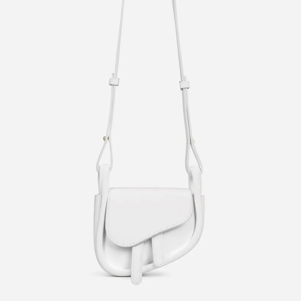 No-Worries Asymmetric Cross Body Saddle Bag In White Faux Leather | EGO Shoes (US & Canada)
