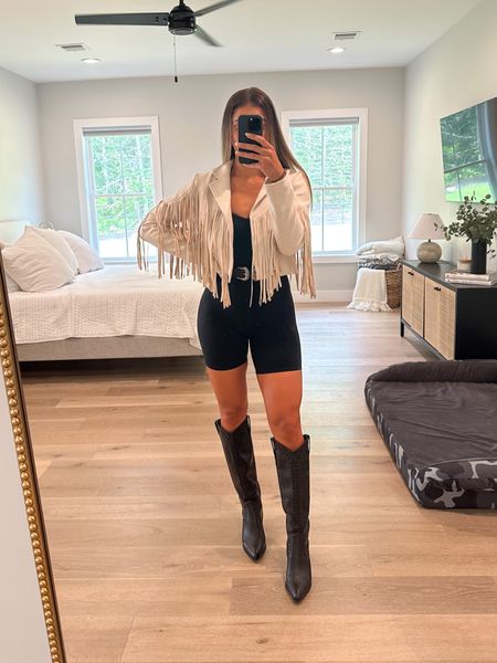 Country concert 🎵 

• western black leather boot, western waist belt, tan suede fringe jacket, knee high boot, bodysuit, amazon finds, show me your Mumu, cowboy boot, Chris Stapleton 