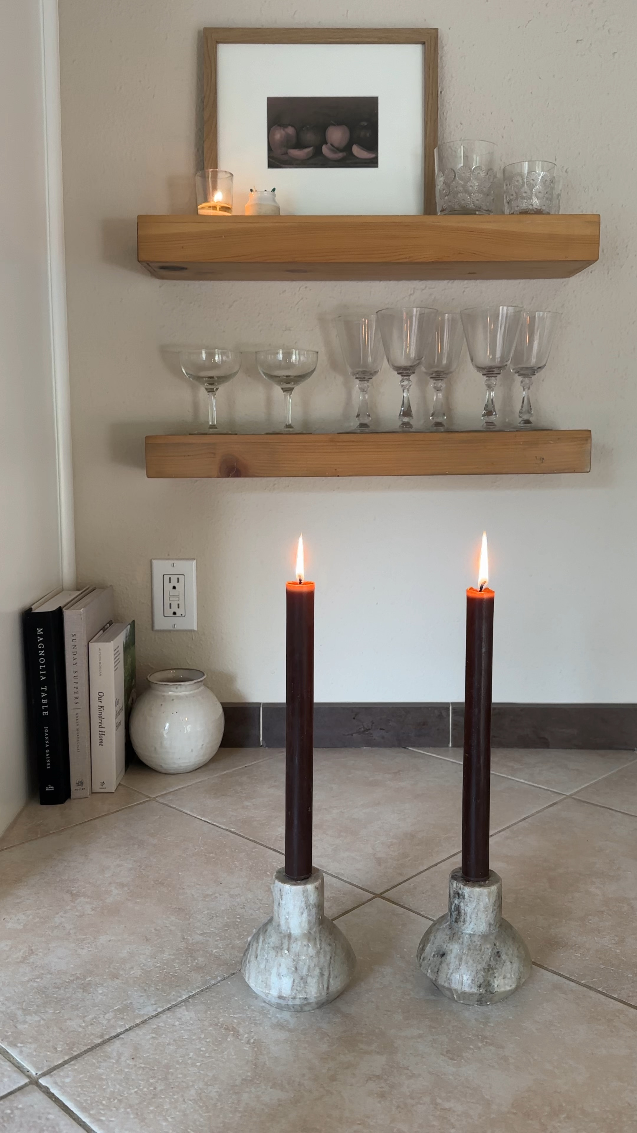 Older kitchens can be beautiful too. Love where you live right now!

Wood kitchen shelves, candlestick holders, cook books, votives, candles.

Glassware is all vintage, art is an original photo 

#LTKfindsunder50 #LTKVideo #LTKhome