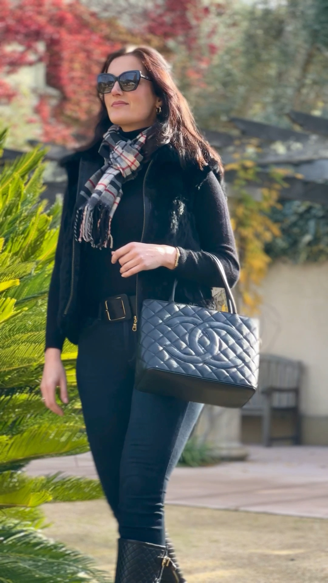 Exploring Sonoma Valley wineries on a brisk sunny day. Chic winter casual outfit featuring a cashmere turtleneck, faux-fur vest, skinny jeans, and knee-high boots styled with a classic Chanel bag and plaid scarf. An elegant cold-weather look for everyday wear, travel days, or polished weekend style. 

#LTKootd #LTKSeasonal #LTKdayinmylife
