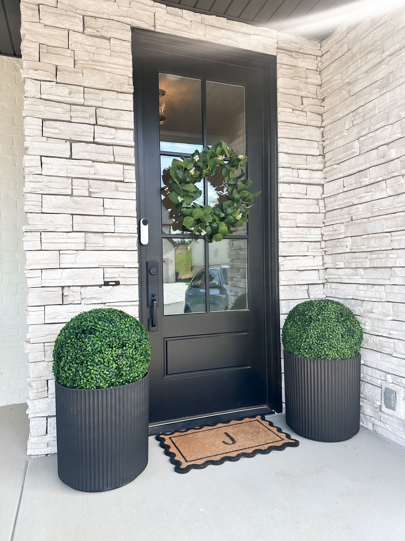 A little front porch spring refresh! I love these circular faux plants! #outdoorfauxplants #outdoor #frontporch #spring #summer #housedecor #homedecor #frontporchdecor 

#LTKfamily #LTKhome