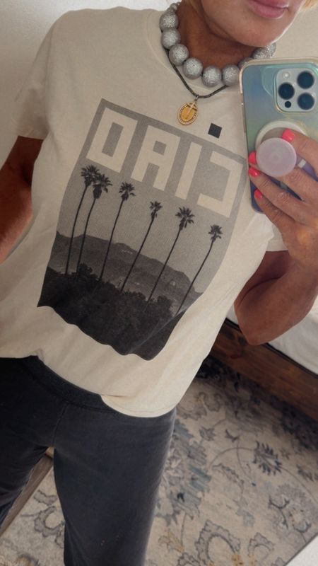I have a graphic tee obsession.  They add so edginess & character to my outfits. I sized up to a lg 

#LTKTravel #LTKStyleTip