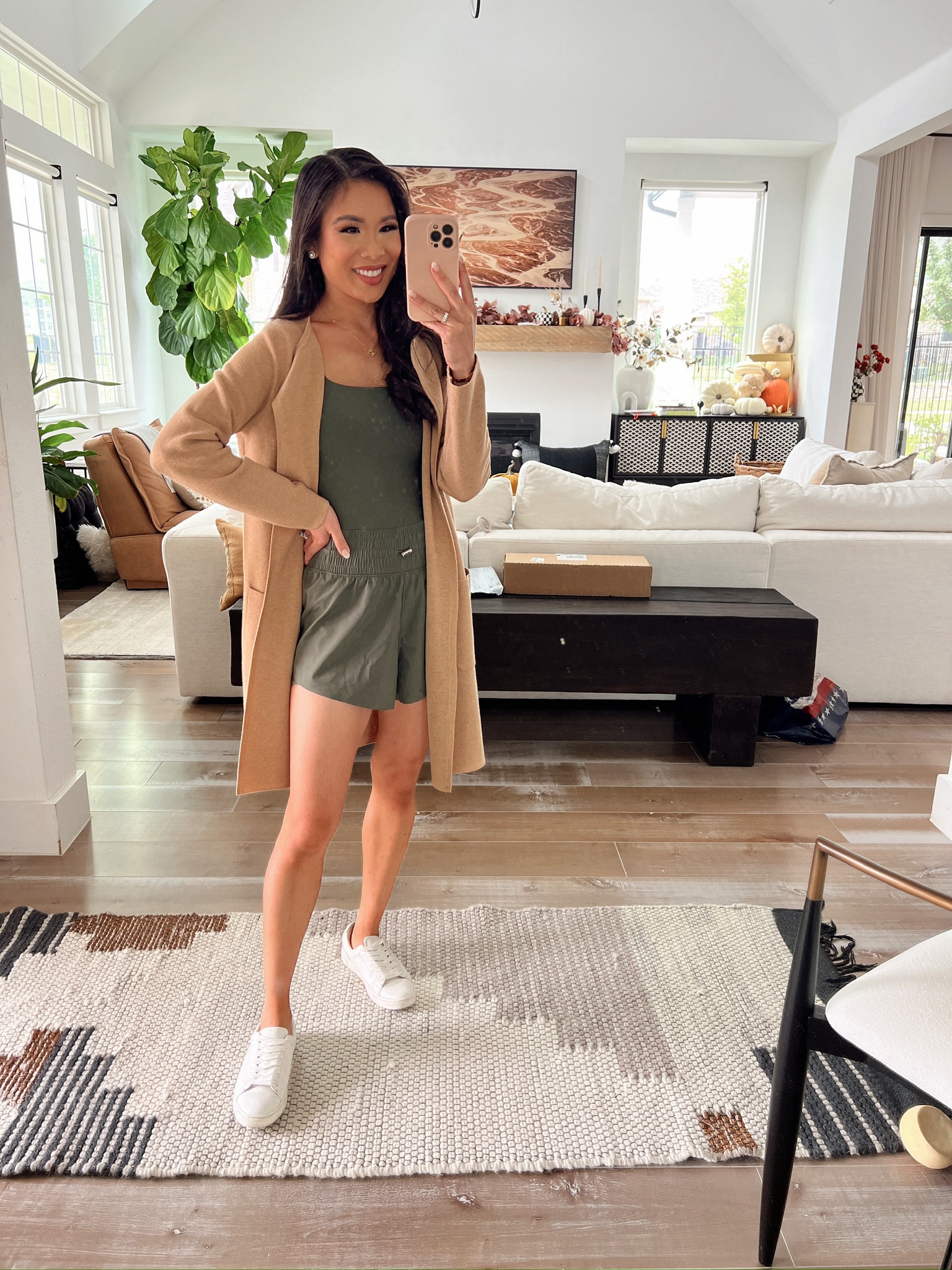 Summer to fall transitional outfit with green onesie romper paired with the best sweater cardigan that is on sale for 40% off! Wearing size 2XS 

#LTKStyleTip #LTKSeasonal #LTKSaleAlert