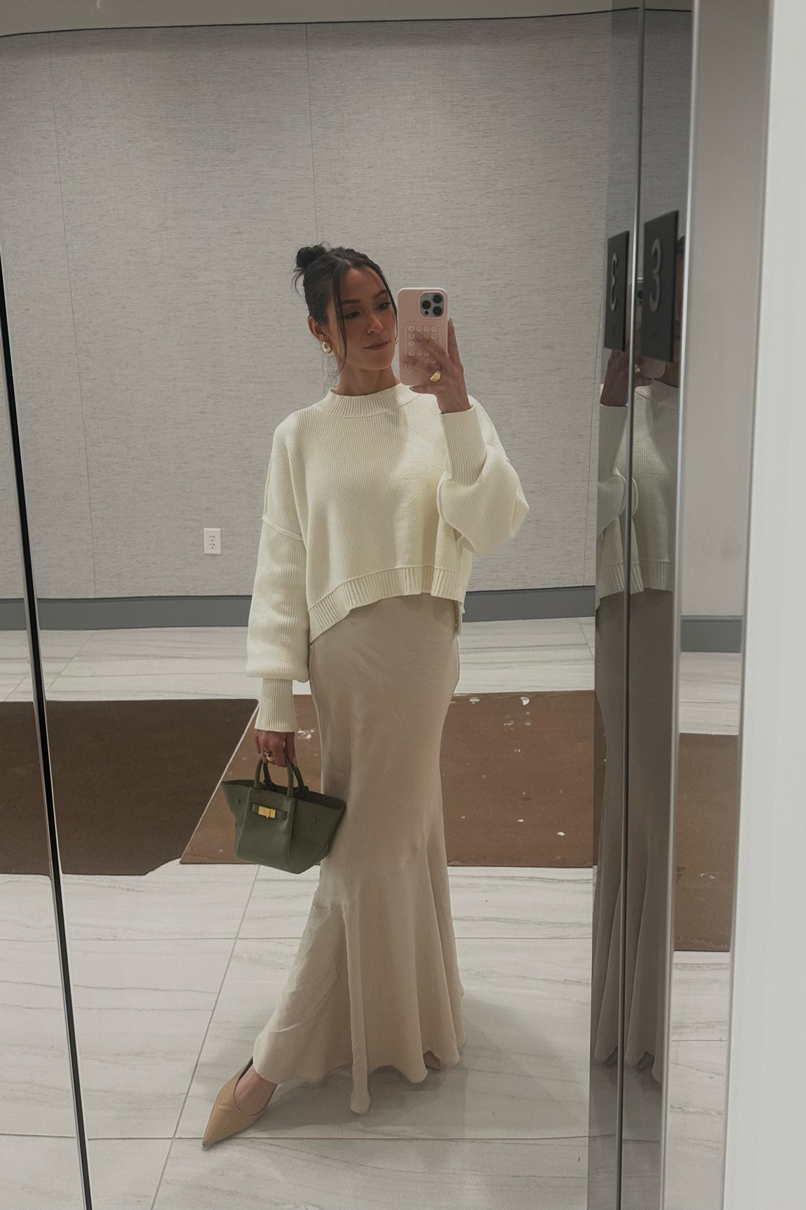Cozy work outfit for the colder days❄️ 

This outfit works because the structure of the bag and pointed toe shoes offset the softness of the sweater and skirt. The mix of satin, knit, and leather also keep the outfit interesting, even though it’s very simple.

You could recreate this look with any satin skirt in your closet and a sweater in the same shade. Keep in mind that it doesn’t have to be exact, as long as both shades are in the same color family or have the same undertone. For example, this champagne skirt and ivory sweater both have a slightly yellow undertone to them, so it works! 

This @freepeople sweater pairs great with a satin skirt because of it has a little structure to it and hits just below the waist. It’s a crop, but fully covers the stomach if you have on high waisted bottoms. 

I’m not typically a flats gal, but @samedelman and @tonybianco have some that are very chic and timeless. I like to wear mine with a maxi skirt for added comfort, and you can’t even tell that they aren’t a heel! 

#LTKWorkwear #LTKHoliday #LTKStyleTip