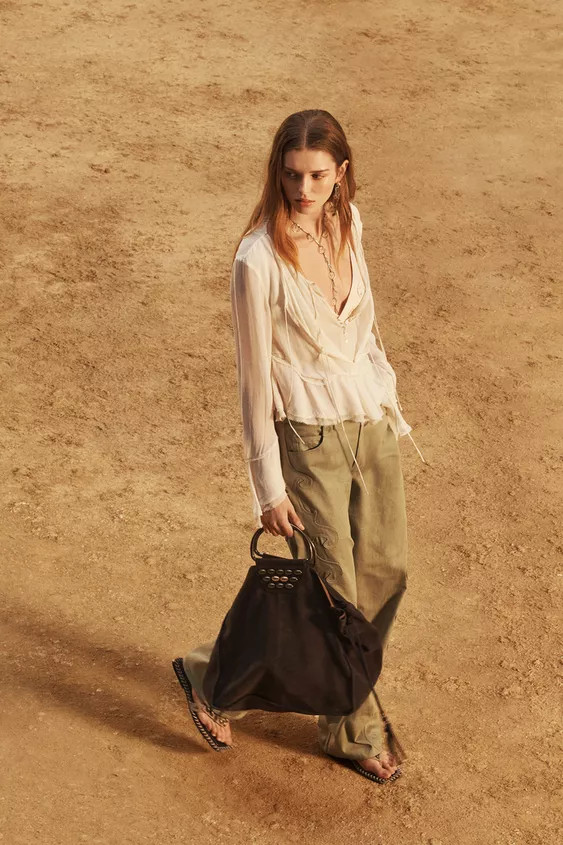 Trousers made of 100% cotton yarn. Mid-rise waist with belt loops. Front and back pockets. Side d... | Zara UK