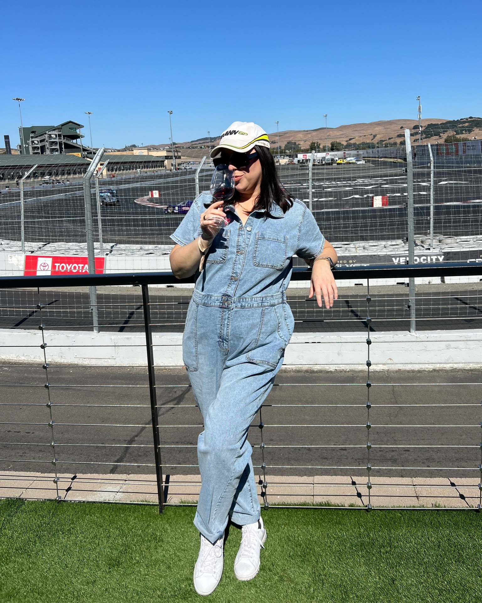 What to wear to race day / jean jumpsuit / denim jumpsuit / jean boilersuit / denim boilersuit / white sneakers / stan smith adidas / race track outfit 

#LTKMidsize #LTKFindsUnder50 #LTKTravel