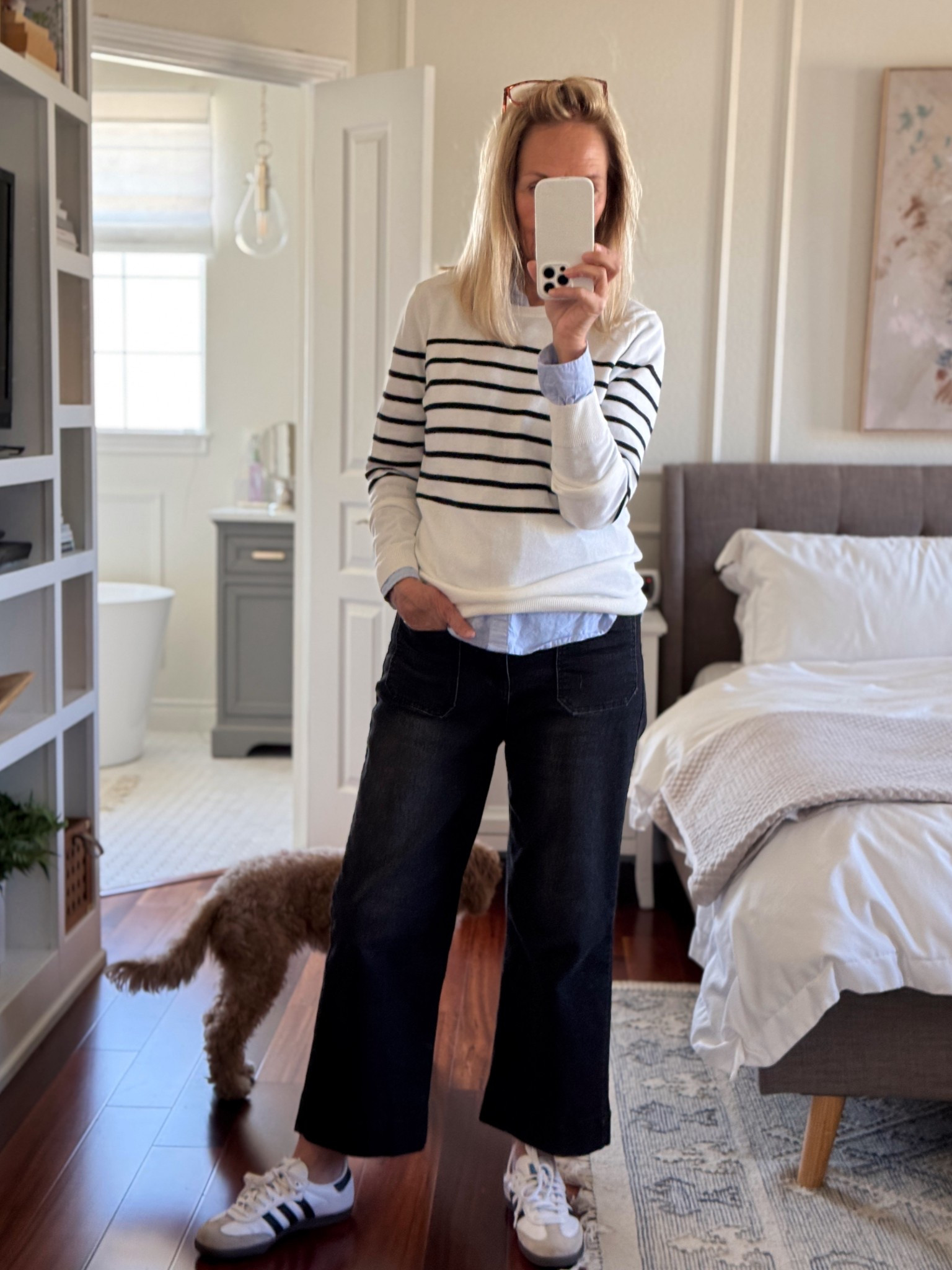 Outfit idea for in-between weather -- striped sweater over a light blue cotton button down shirt + cropped wide leg black jeans 

#LTKFindsUnder50 #LTKOver40 #LTKStyleTip