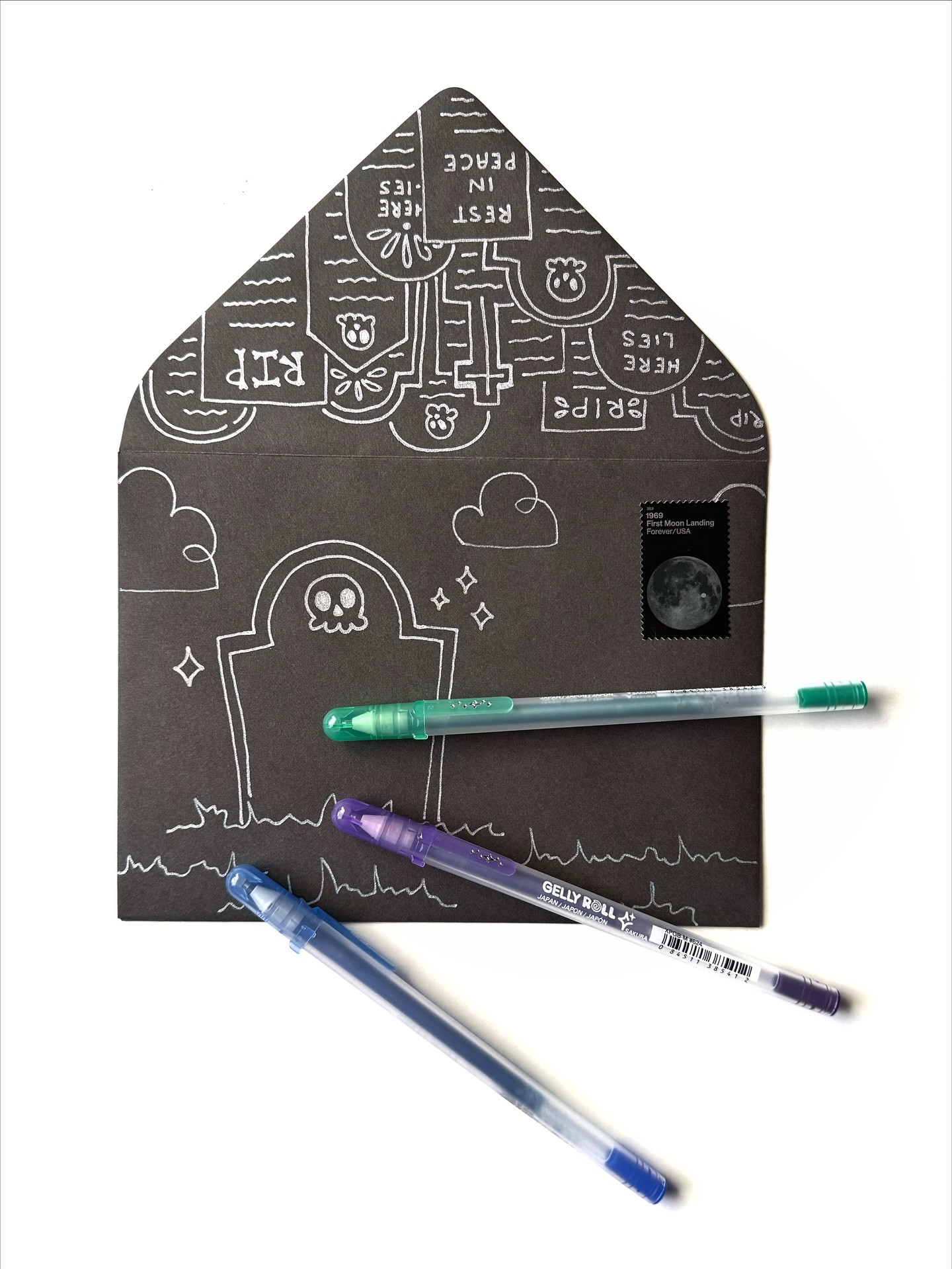 Day 23: Graveyard 🪦💀🌒

I ended up focusing on the envelope flap this time, so this envelope hints at the theme on the front and then really layers it on when you flip it over. Apologies to the name I write on the headstone on the front. 😳😬 I wish you no ill will.

🖊️: @sakuraofamerica Gelly Roll Silver Shadow pens
✉️: @papersource
.
.
.
#bewitchingenvelopes #bewitchingenvelopes2025
#papersource #bewitchingenvelopes #countdowntohalloween #halloweencountdown #halloween #halloweenlove @papersource #papersource #papersourcecreativecollective #graveyard #gravestone #gravestoneart #halloweenmail #envelopeart