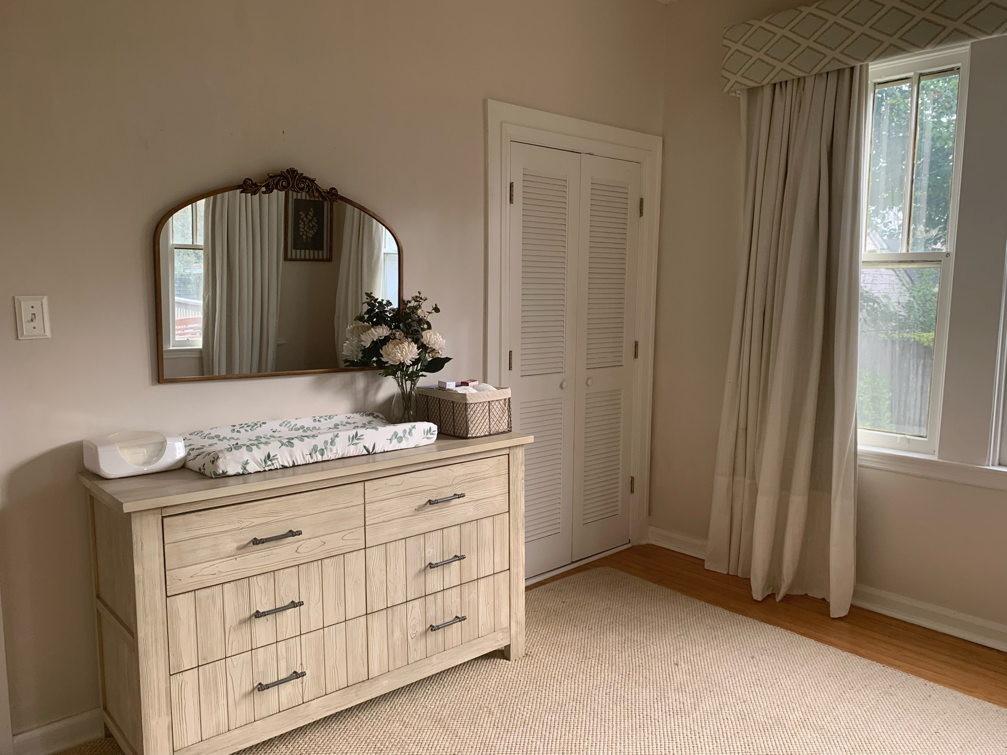 Neutral baby girl nursery. Anitque gold/brass mirror.

#LTKhome #LTKfamily #LTKbaby