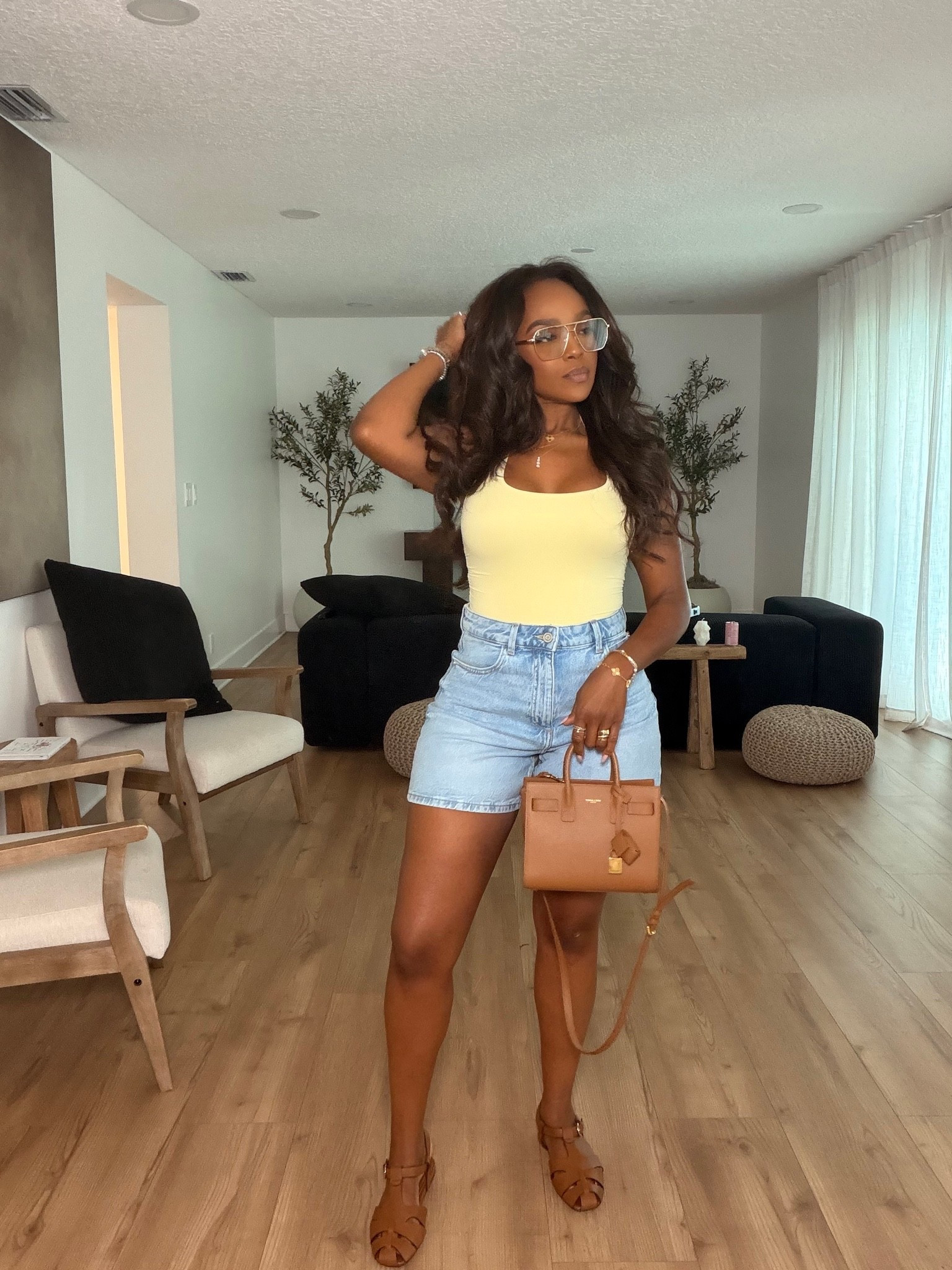 Hi babes!

This is one of those easy summer outfits that always works ☀️ The light wash denim shorts paired with this buttery yellow tank gives such an effortless, clean girl vibe while still looking so put together.

Where to wear this:
Brunch
Errands
Casual summer days
Vacation
Weekend outings

I love outfits like this because every piece can be mixed and matched so many different ways — from the denim shorts to the neutral accessories — making the cost per wear so worth it.

Everything is linked below

xx Kira | Kira’s Fashion Finds

34D - 27 - 40 | size small or 4
