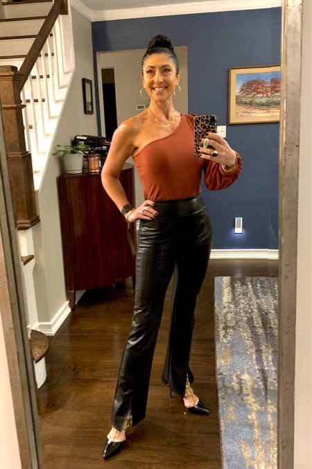 Date night OOTD. One shoulder bodysuit and faux leather bootcut leggings. Gold studded black and nude strappy pumps. 

#LTKunder100 #LTKshoecrush #LTKstyletip