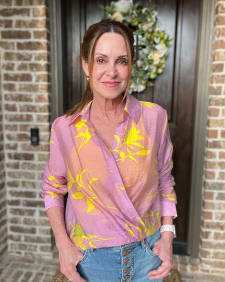 How pretty and feminine is this cabi top? It’s a beautiful orchid background with bright yellow flowers. It’s more a cropped length and a little bit sheer. I like wearing it with a little cami underneath. 

#cabiclothing #summercollection #petitestyle