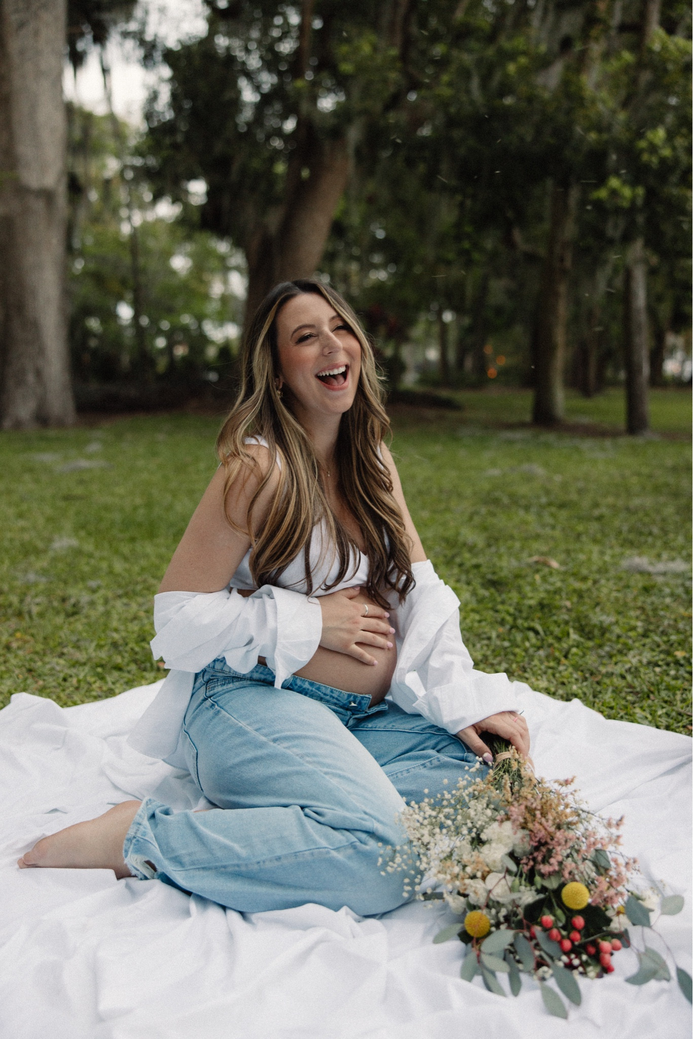 Casual maternity photoshoot inspiration! White cotton sheet, white cotton oversized button up, ripped maternity boyfriend jeans, maternity bra. Jeans size medium, oversized shirt size large, bra size medium!

#LTKbaby #LTKbump #LTKbeauty