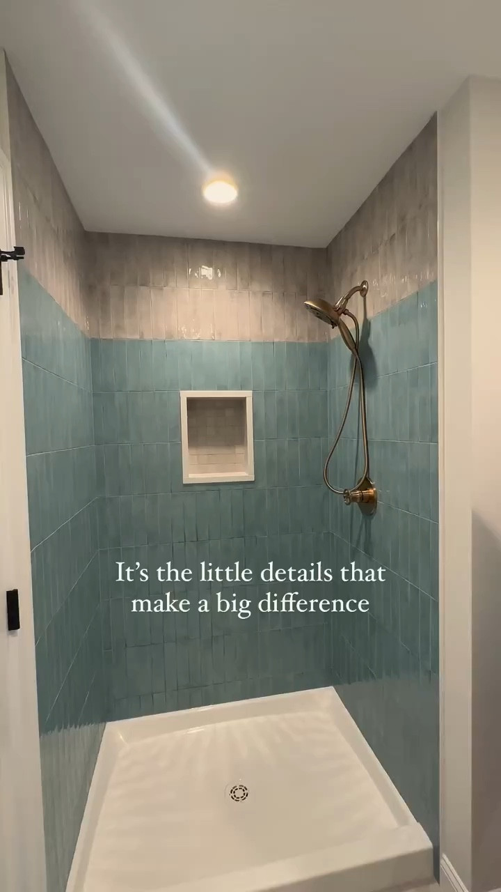 Details matter! This wheel shower valve was such a pretty touch, adding a bit of a vintage feel to an otherwise modern bathroom.

No shower would be complete without a built-in niche, and we thought it would be fun to do a two-toned shower tile in turquoise and a neutral beige up top.

Project: Nature-Inspired Hope Tour

#showertile #goldhardware #cozybathroom #nauticalbathroom #vintagehardware #bluetile