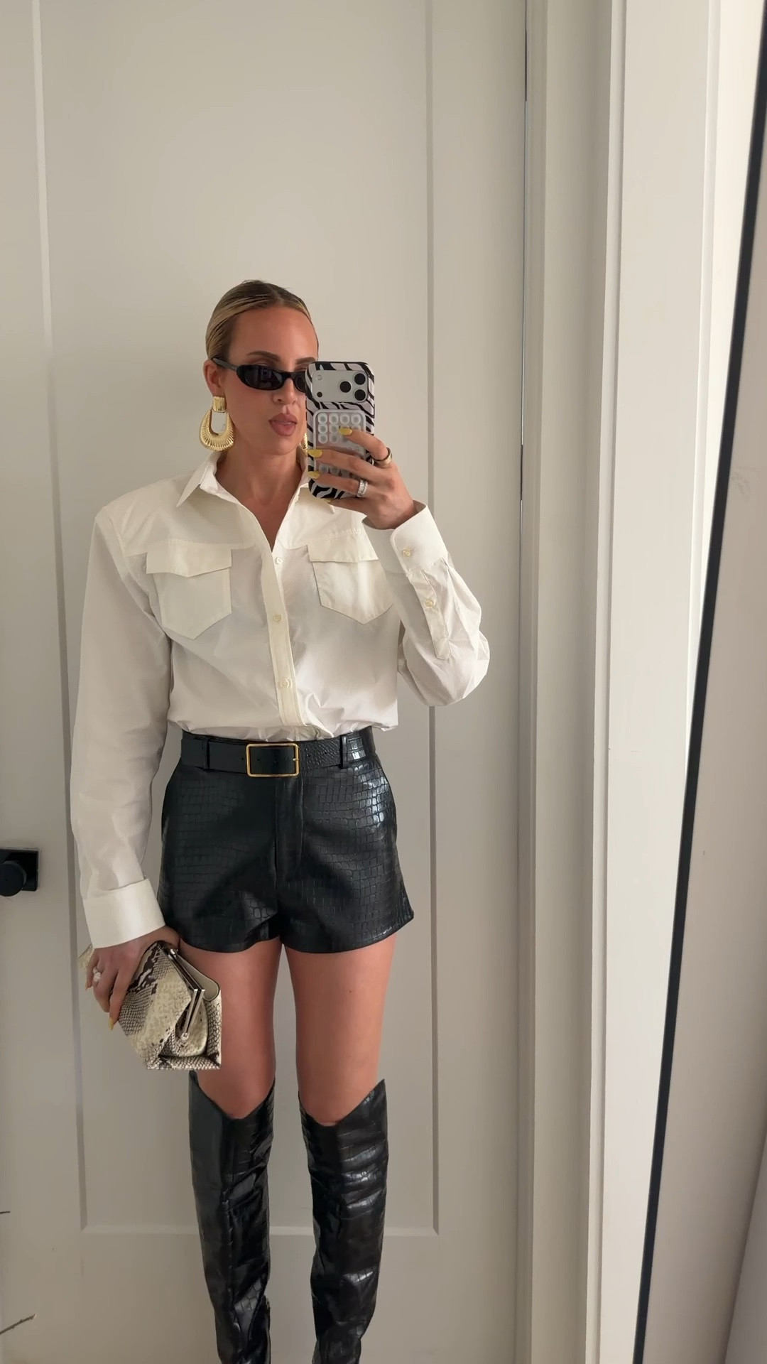 I’m not able to link my top, but I linked a few that look like it below. I’m wearing a small in the shorts. Boots run tts￼

#LTKTall #LTKootd #LTKOver40