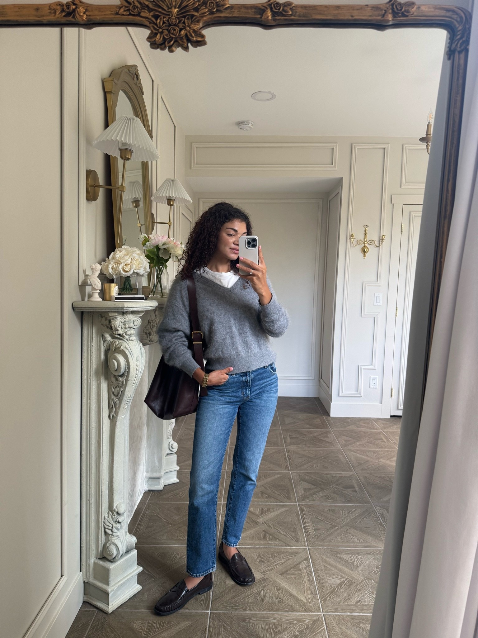 Casual chic outfit: jeans, white tee, v neck sweater, bucket tote

#LTKootd