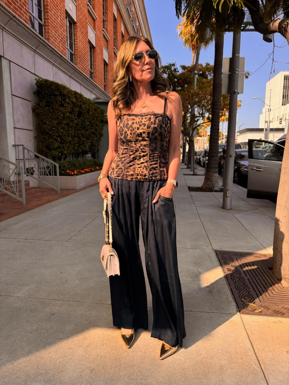 ✨ Outfit of the Night Inspo! ✨
This fitted leopard top from @ateleio_ is one of those timeless pieces that works so many ways. I styled it here with flowy black pants from @neu.nomads for an event + dinner—effortless, comfortable, and so chic. 🖤🐆

You can easily dress it up or down: think jeans, a sleek skirt, or a mini for a different vibe. Just add gold jewelry, heels, and a great bag, and you’re ready to go!

Shoes: Prada | Bag: Dior | Sunnies: Celine

#OOTN #LeopardStyle #EffortlessChic #LTKStyle #LTKNightOut #VersatileStyle #EverydayGlam #StyleAtAnyAge

#LTKFindsUnder100 #LTKStyleTip #LTKFindsUnder50