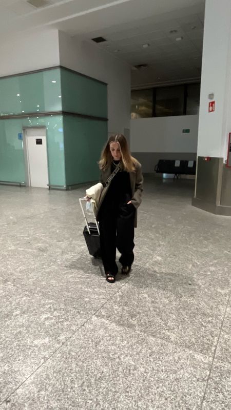 I love this airport outfit formula… loose fitting black trousers, a plain black top, an oversized blazer and a pair of Dad sandals 🖤
Airport outfit ideas | Travelling outfit | Holiday outfit | Arket oversized blazer | Black silk trousers | Elasticated trousers | Cross body bag | Linen trousers | Pull on trousers | Skims trousers | black suitcase cabin bag

#LTKsummer #LTKtravel #LTKeurope