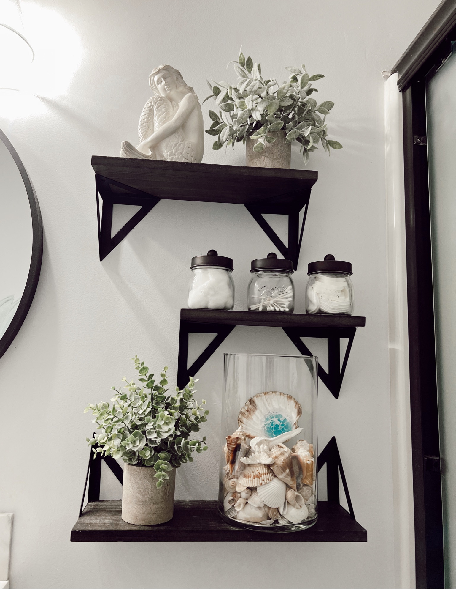 These floating shelves are perfect for storage or decor. Also linked are these cute fake plants. And a similar white mermaid figure 

#LTKhome