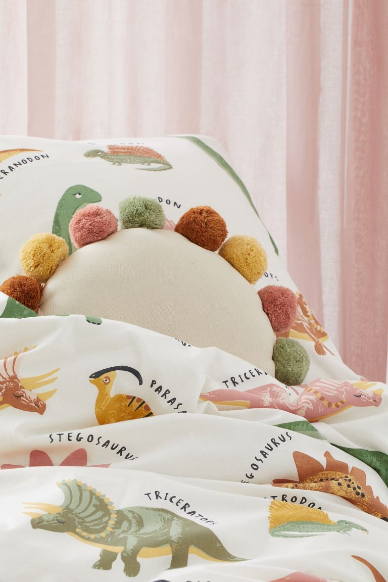Round pompom-trimmed cushion | H&M (UK, MY, IN, SG, PH, TW, HK)