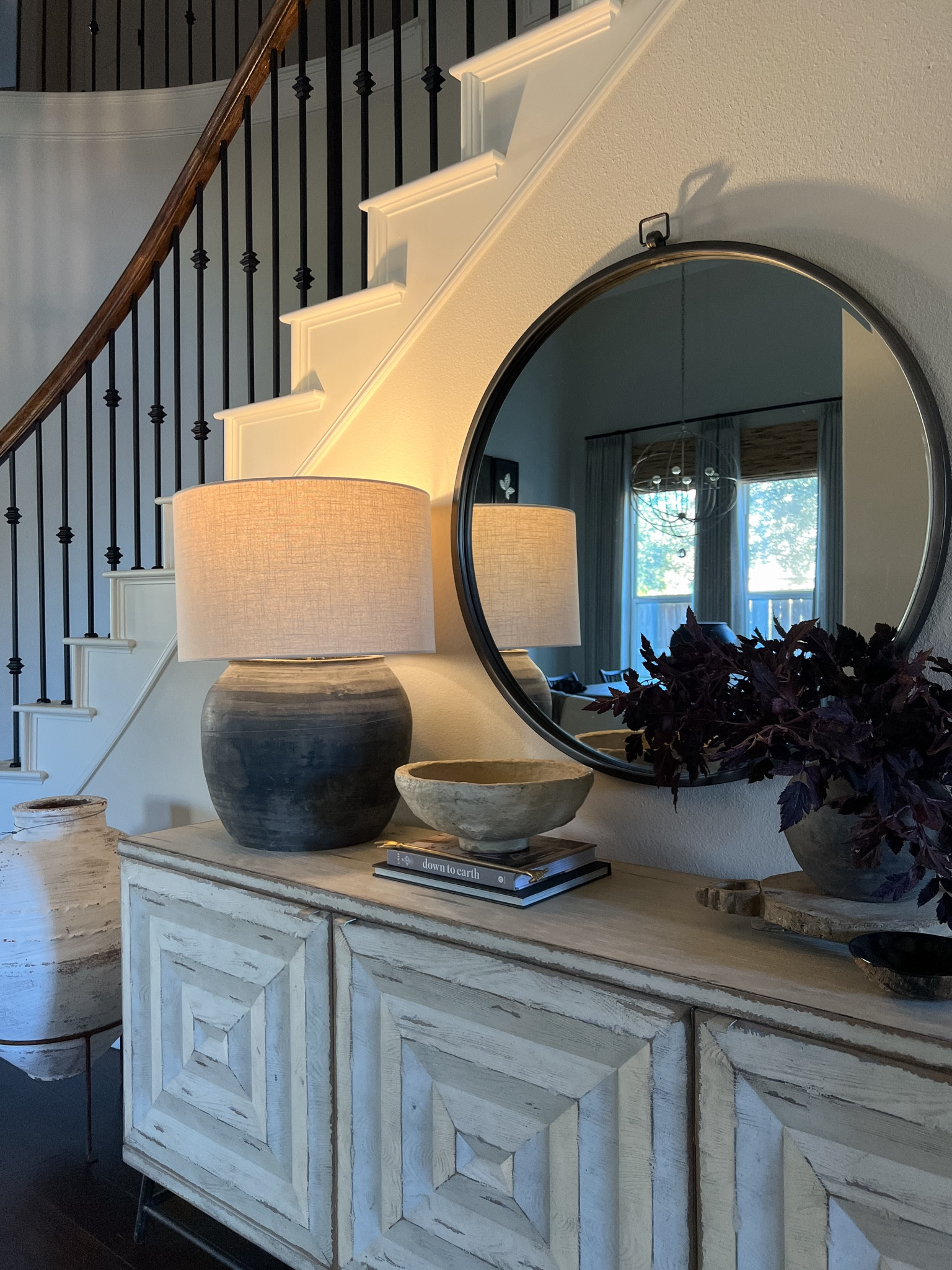 My lamp hack!  I placed my old Target lamp inside my vintage black vase and topped with a large drum shade.

#LTKhome