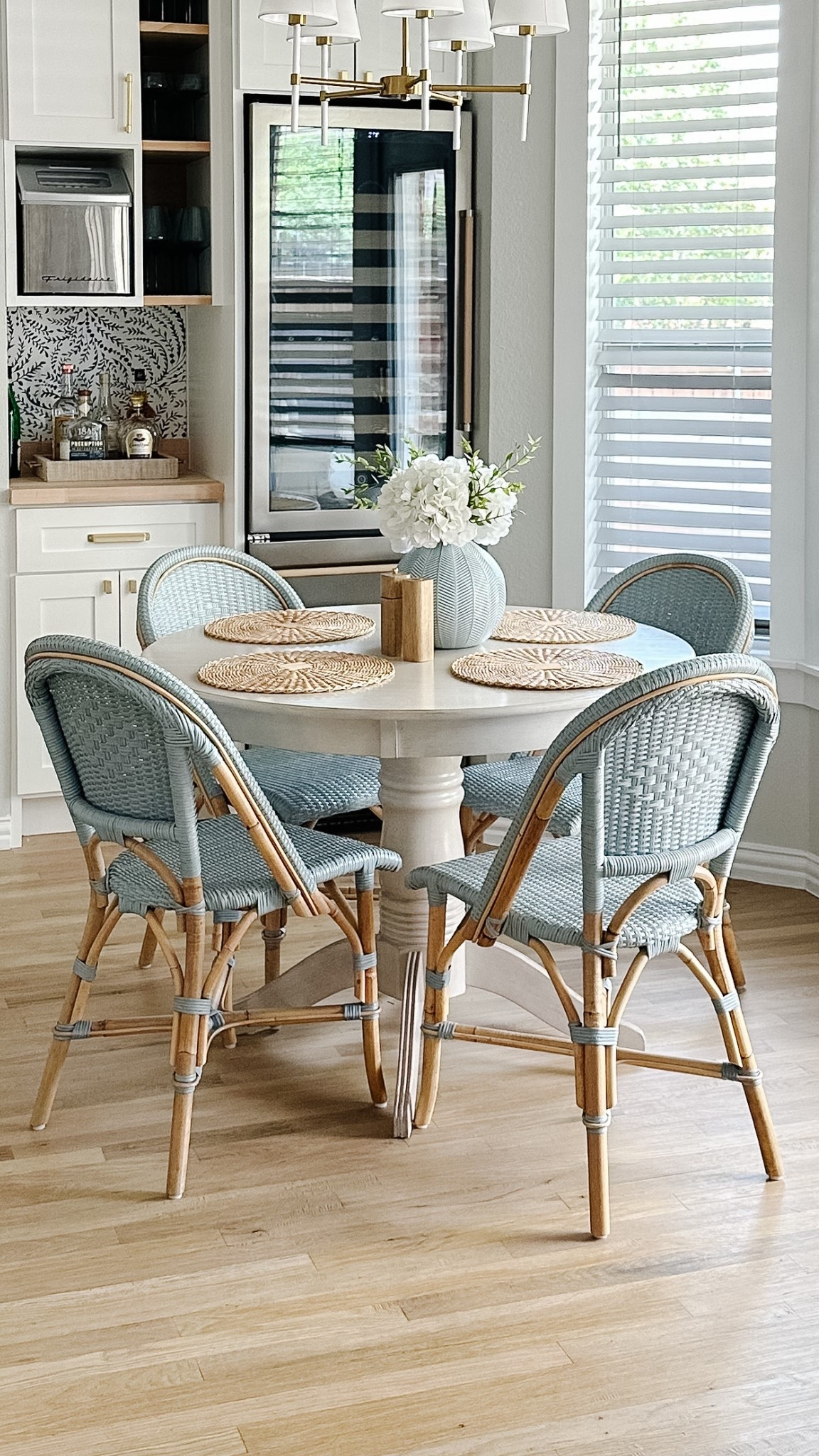 The round table everyone asks about is finally BACK IN STOCK!
This cozy nook is one of my favorite spots in the house—classic, coastal, and perfect for casual meals or coffee chats. I paired it with blue bistro chairs for a laid-back yet polished look.
	•	Round pedestal dining table (back in stock!)
	•	Coastal blue bistro chairs
	•	Textured placemats
	•	Ceramic vase + faux florals
	•	Built-in beverage center details

#LTKHome #LTKBackInStock #CoastalStyle #DiningNook #HomeFavorites #LTKFinds #SerenaAndLilyStyle #TimelessInteriors

#LTKSaleAlert #LTKHome #LTKStyleTip