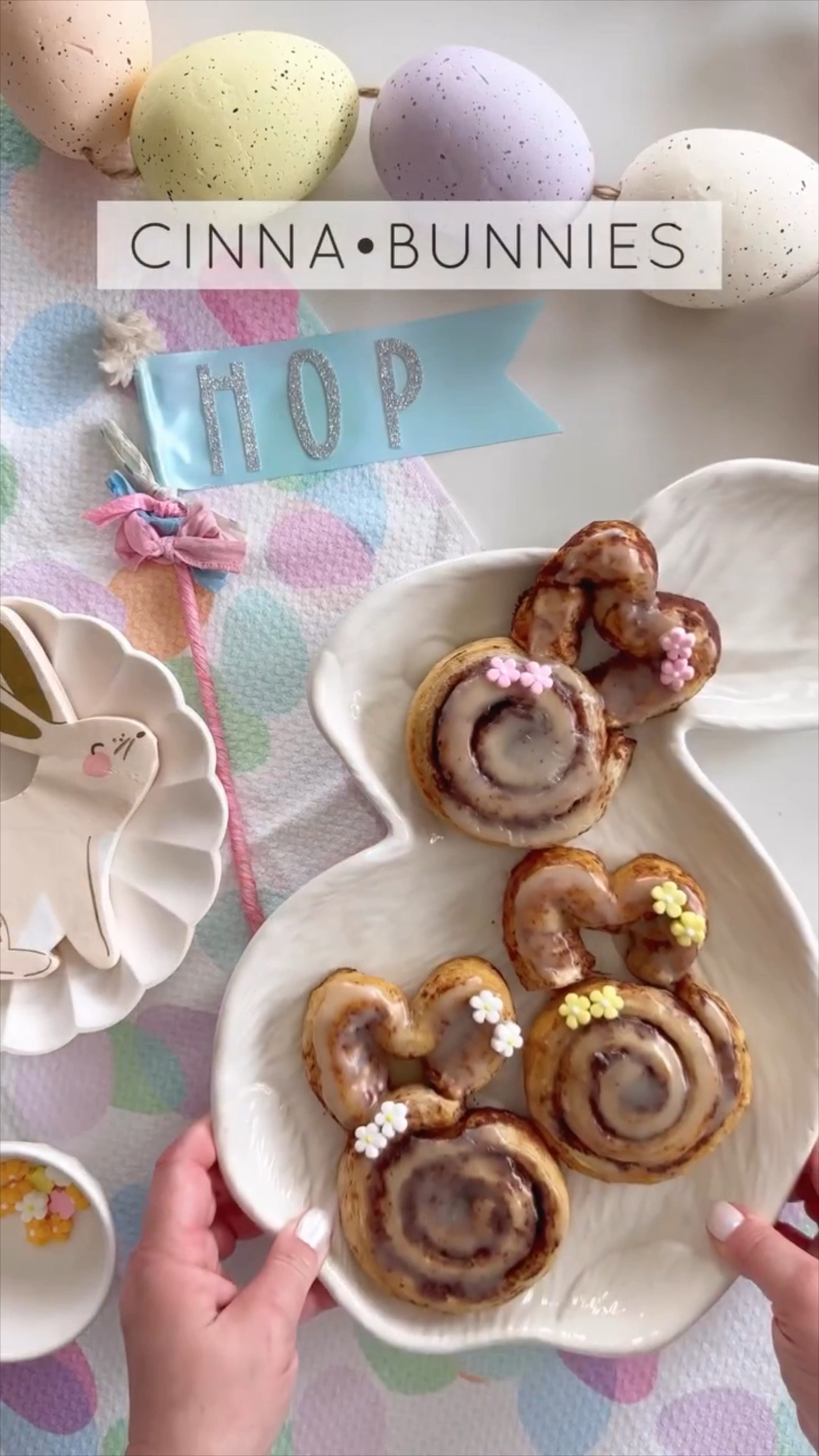 Cinnabunnies for Easter 

Preheat your oven to 350°F. 

Line two large baking trays with parchment paper.

Remove the cinnamon swirl dough from the packaging. Place 6 of them between the two trays.

Taking one of the remaining rolls, unroll the swirl and cut in half so you have two longer pieces. Shape these into 2 large horseshoe shapes to form the ears. Pinch the ends together and press these into the top of the cinnamon roll so that they are touching. Repeat with the remaining dough.

Bake for 11-14 mins, until risen and golden brown. Meanwhile, make the icing as included in the cinnamon swirl pack instructions.

Once the rolls have cooled slightly, drizzle the icing and adorn with sugar flower decoration.  

#easter #easter2024 #family #home #baking #party #holiday 

#LTKfamily #LTKSeasonal #LTKVideo