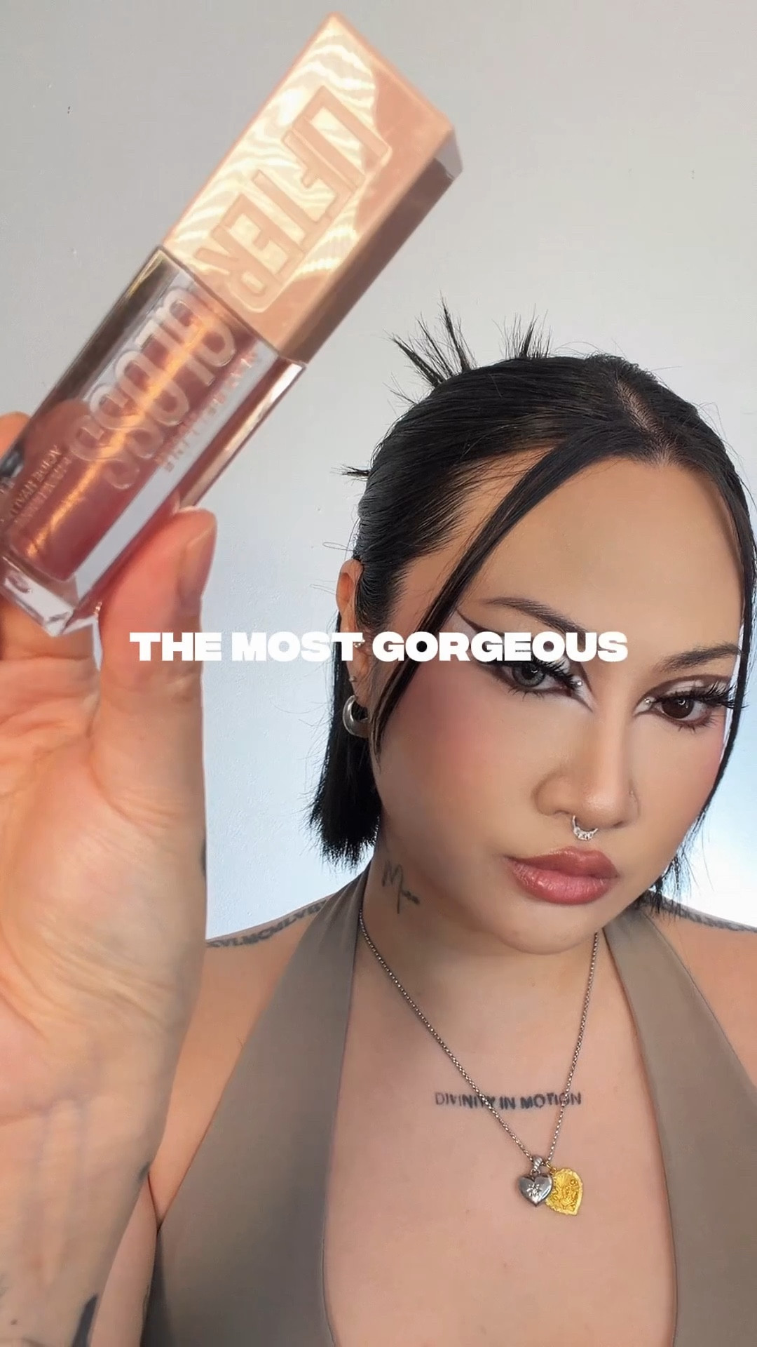 Affordable makeup 💄 $10 drugstore gloss with 50k+ reviews on Amazon. Maybelline LIFTER GLOSS in “BRASS” 💋 One of THE MOST high shine, non-sticky, BEST glosses out there oh my goddd. The shine that shows in photos!!! I’m so happy about this topper gloss. It’s a sheer pink and specks of gold glimmer. I love this because I want a touch of pink but not too much with the right size APPLICATOR. This is an XL applicator so it EVENLY coats that glossy shine ON. And boy do I want that ultra glossy high shine and this served it. This is what I imagined a gloss should be and now I can live it 😂 it’s hydrating, plumping (with shine, NOT sting), has hyaluronic acid. #affordablemakeup #highshinegloss #lipgloss #pinklipgloss 

#LTKFindsUnder50 #LTKgrwm #LTKBeauty