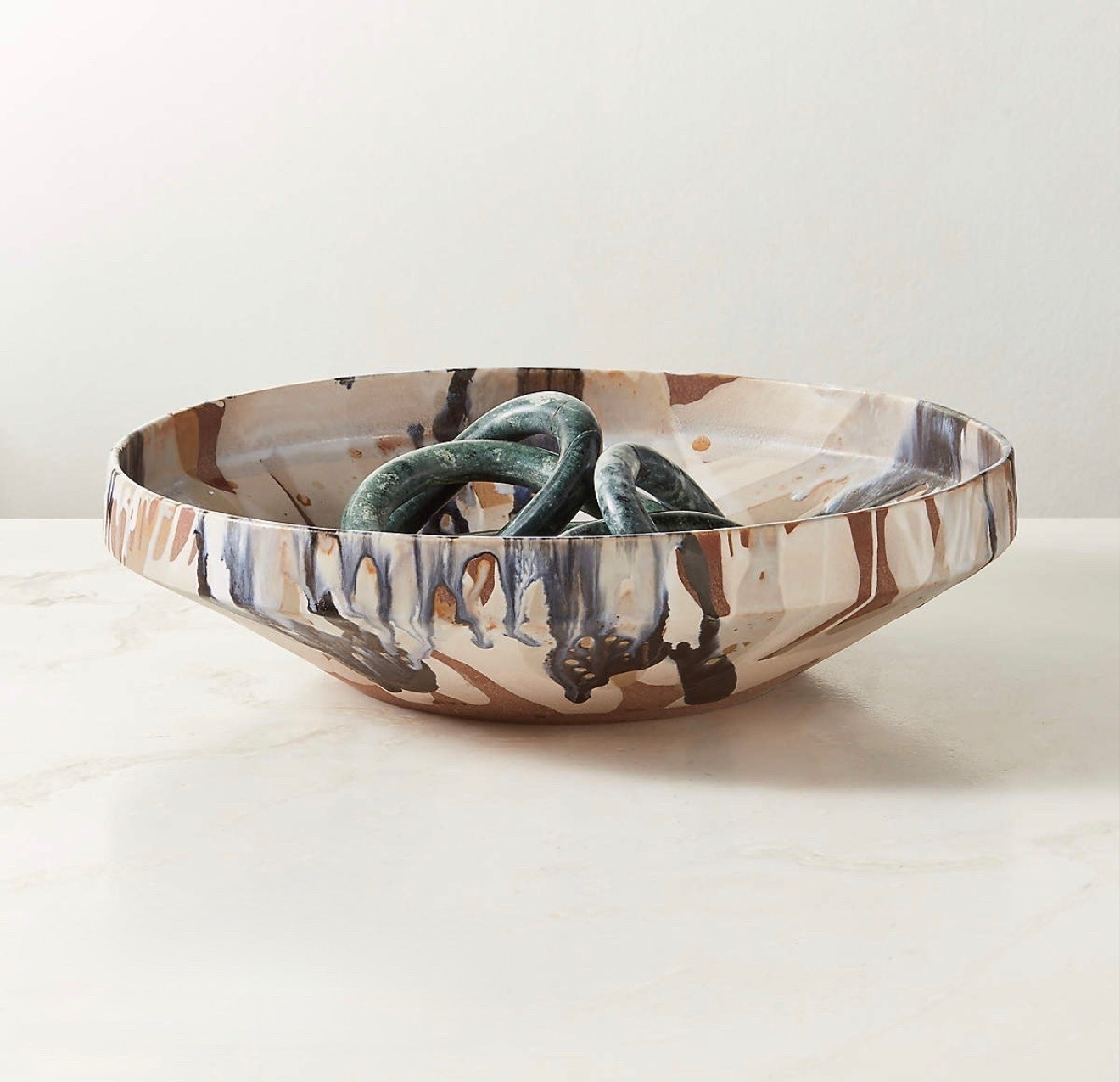 Notus Tan And Black Ceramic Decorative Large Bowl With Reactive Glaze

Stunning ceramic bowl is glazed by hand in Portugal for a pop of pattern. Each bowl is individually slip-cast and finished with layers of richly colored reactive glazes to create an elegantly abstract pattern

#LTKMothersDay #LTKSeasonal #LTKHome